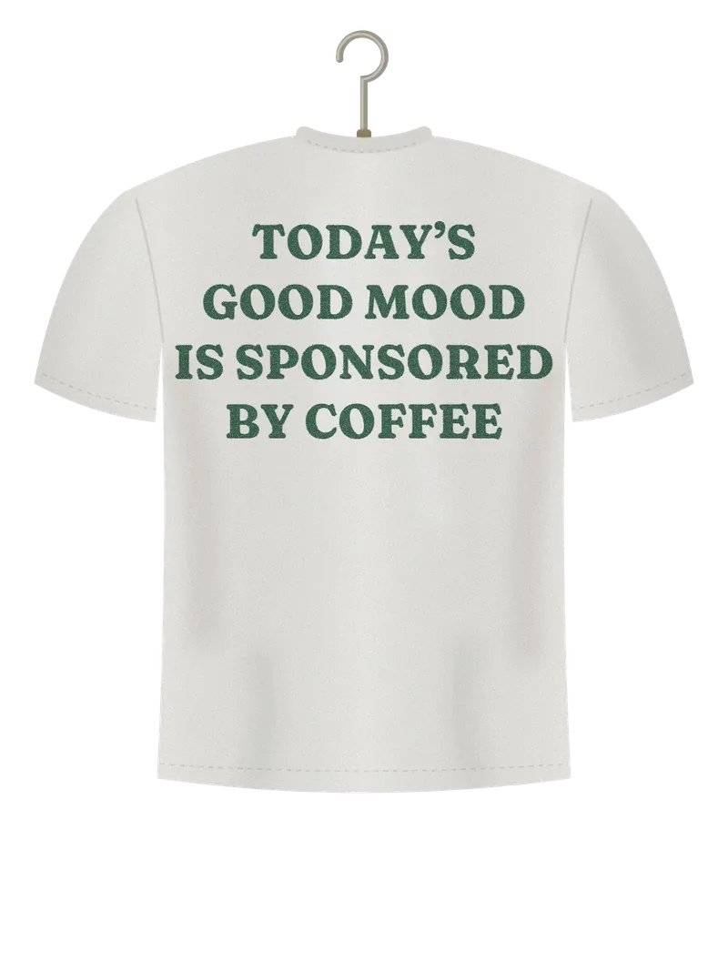 Good Mood, Sponsored by Coffee, off-white t-shirt on a hanger, back view: the words Today's good mood is sponsored by coffee in bottle green